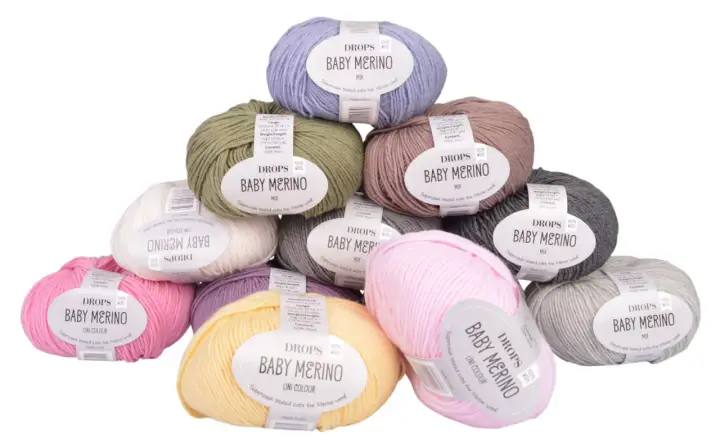 Här är ett urval av DROPS Baby Merino-garn i olika färger, perfekt för att sticka en mjuk babyfilt.